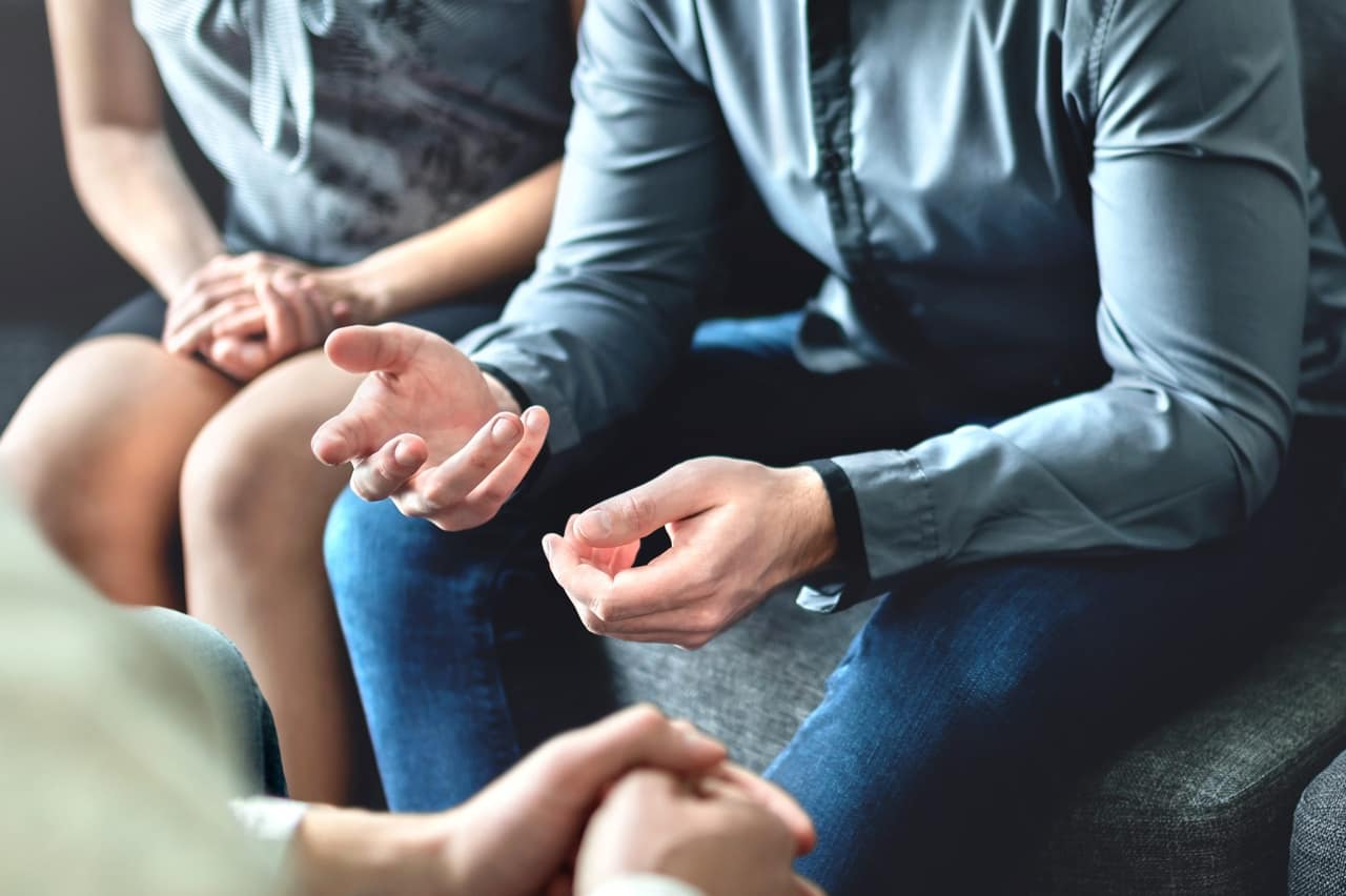 couple counseling or therapy session man talking about problems