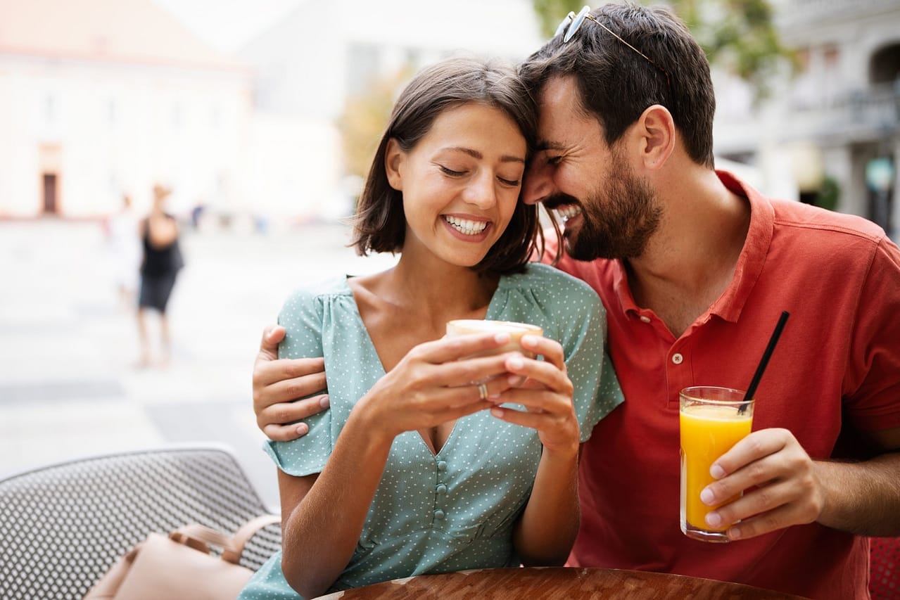 cheerful young couple on a romantic date in a cafe